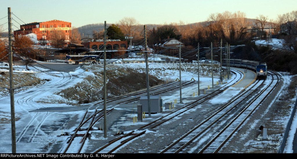  a winter scene as the sun sets on the Lynchburg station with a late Amtrak #20 in house.